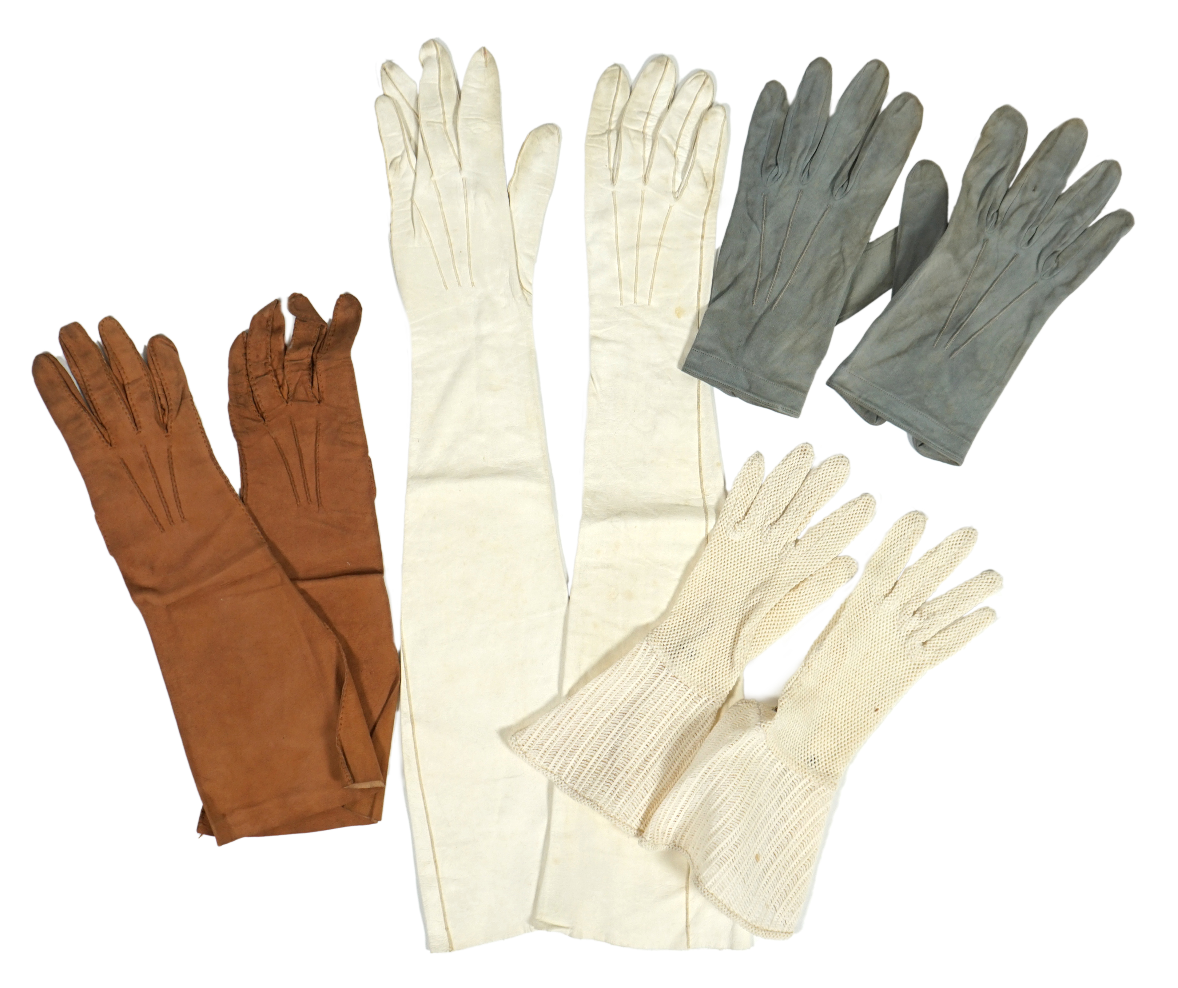 A pair of lady's Hermès skin gloves, boxed and three other pairs of gloves